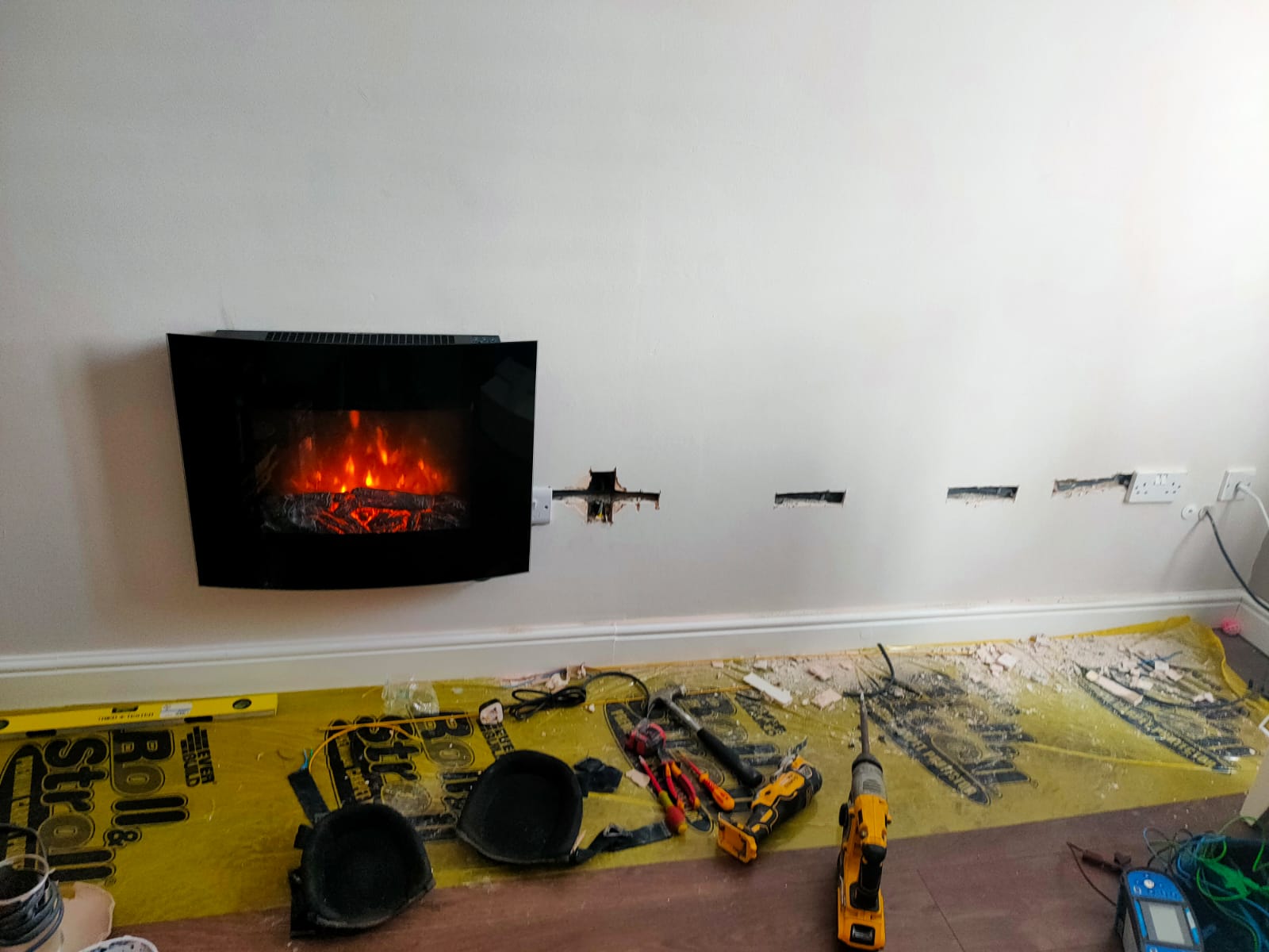 The fireplace is on the wall with precise holes placed into the wall