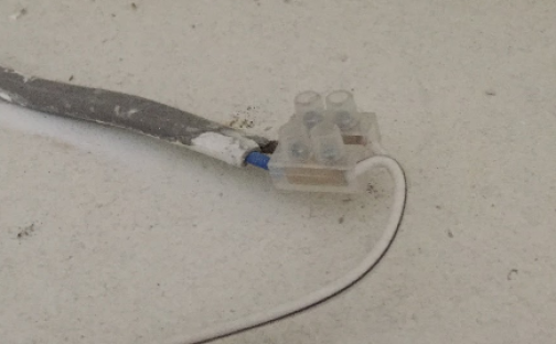 Joint in a cable not enclosed in a junction box.