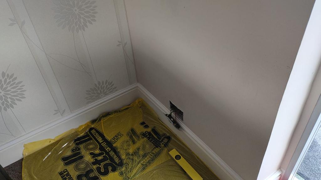 Preparing to fit a new socket by spurring if an existing one. Roll and stroll put down to protect the carpet