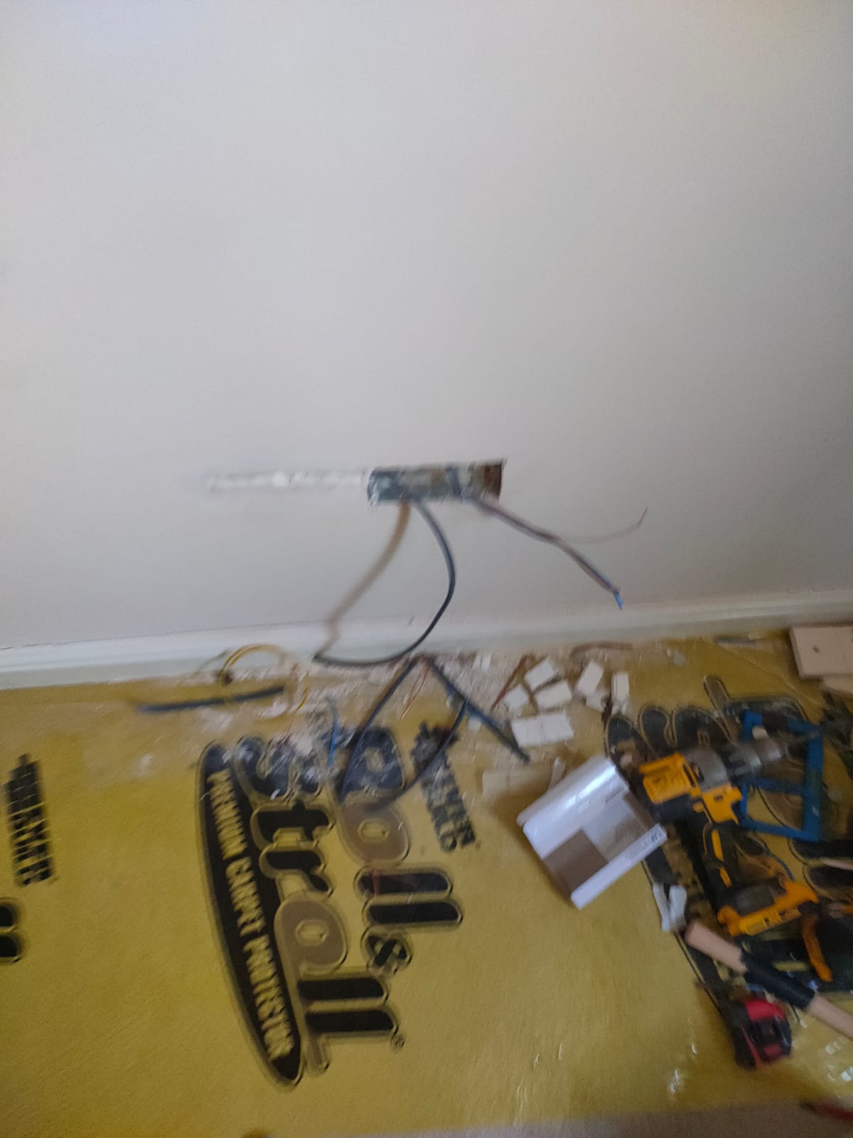 A socket installed on a wall, unfortunatly its a blurry photo but below is some material for protection