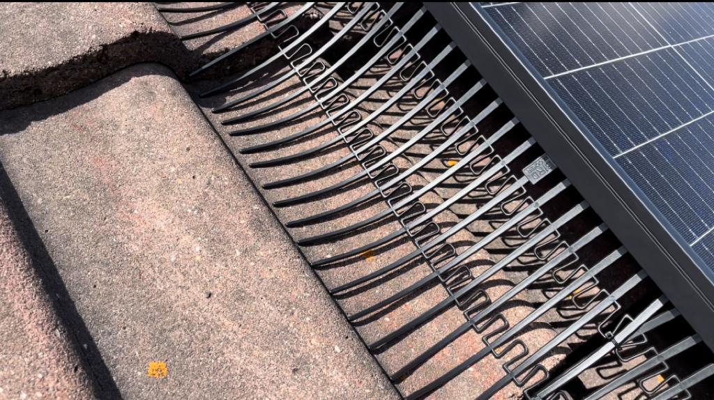 Bird block installed on a solar panel system to prevent birds nest under a solar panel system.