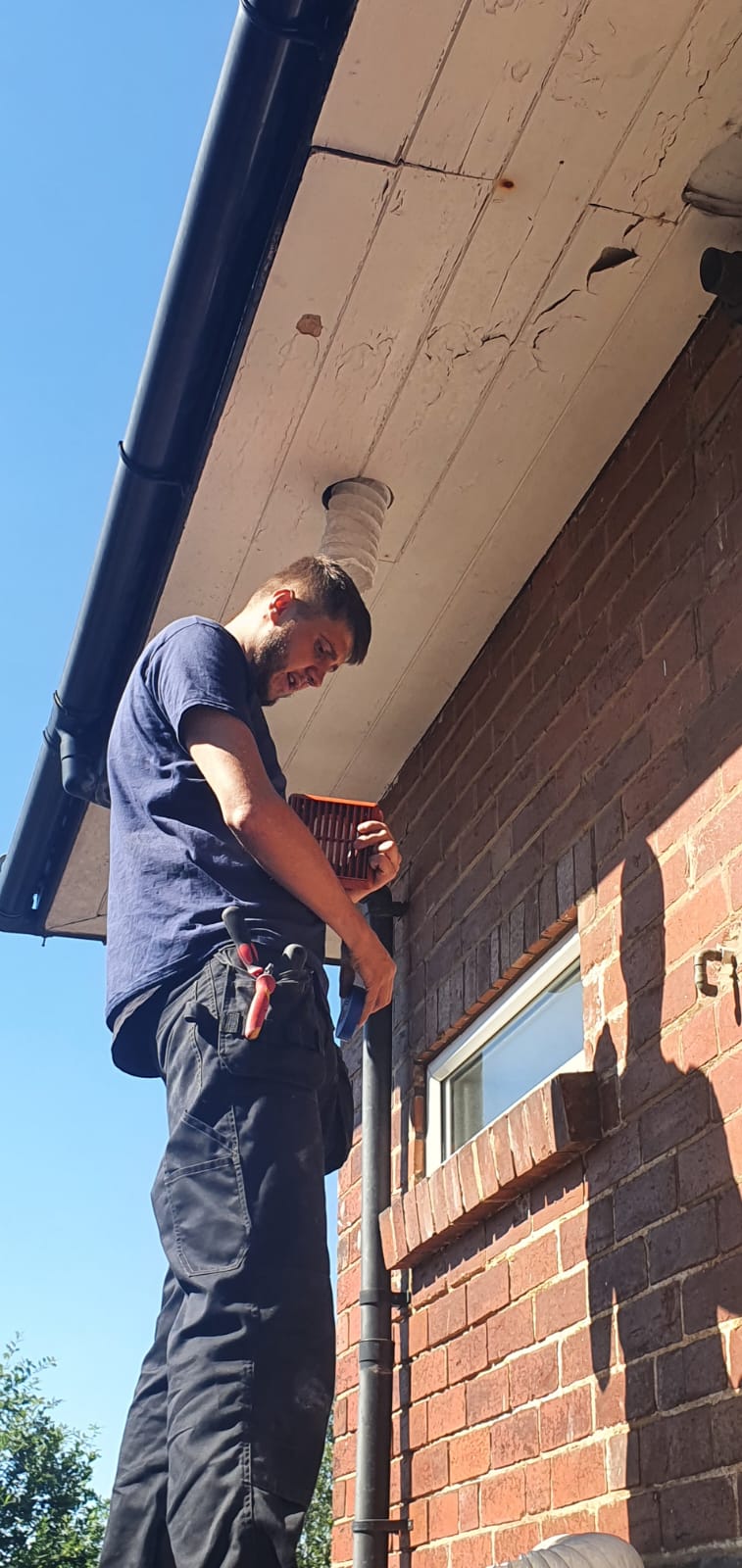 An extraction fan being installed by one of our electricians