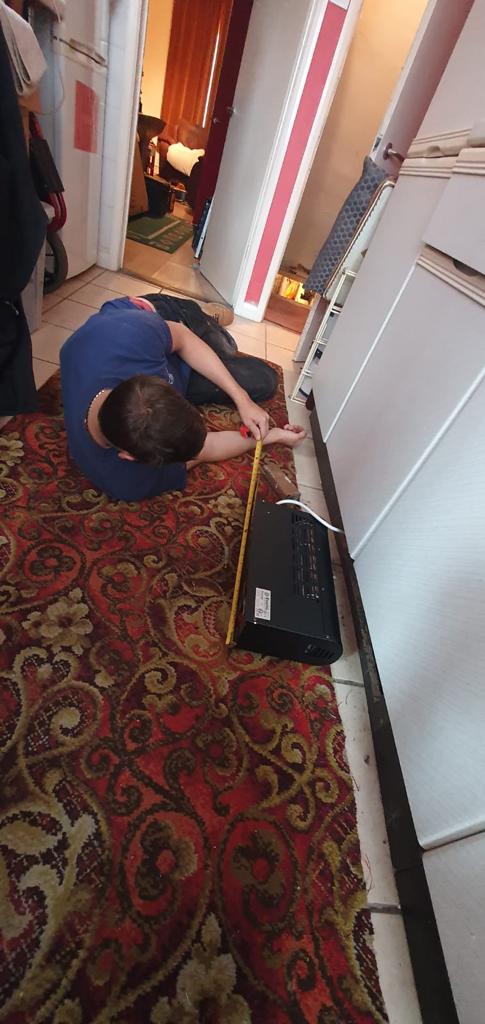 fitting a plinth heater in a kitchen in Derby