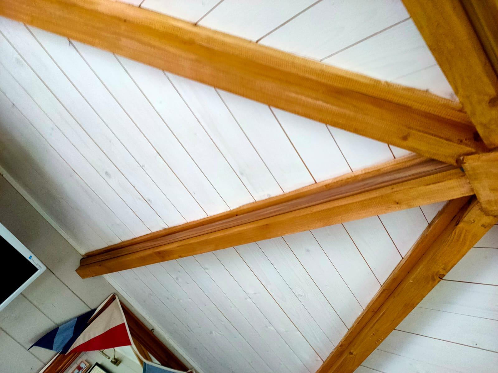 Wood effect trunking blending in with the structure of the man cave